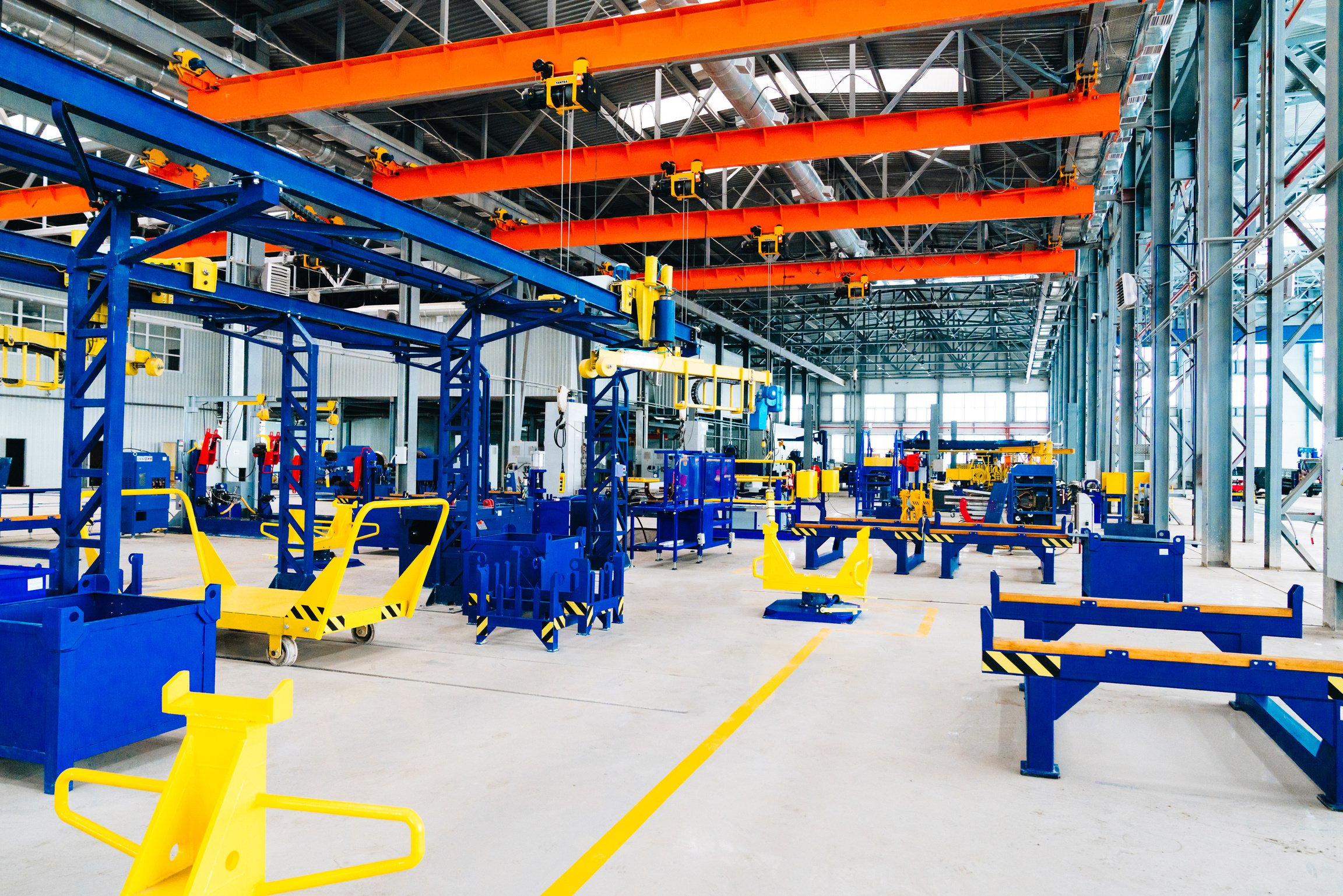 A Warehouse with Yellow and Blue Metal Equipment